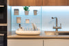 white dish doctor with blue caps, ambient photo in kitchen, dish rack with plates and cutlery