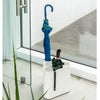 a white umbrella stand called poppins produced by magis design | shop at ikonitaly.com 