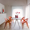 Magis Baguette table and peach Magis Bell chairs