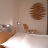 minimaproject wave wooden hanging art in bedroom