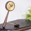 nomon mini puntero t timeless table clock brass on shelf