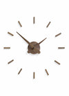 nomon sunset n minimalist wall clock with only stokes, case and hands in walnut wood