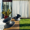 two magis spun outdoor chairs in garden