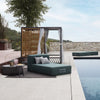 Side perspective of the Atmsphera Alcova outdoor daybed with ergonomic cushions that can be removed from the cabana. 