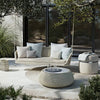 Atmosphera Ludo L4 rocking sofa situated in a garden setting, blending seamlessly with natural surroundings.