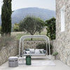 Atmosphera Ludo L5 sofa situated in a garden environment, blending seamlessly with natural surroundings.