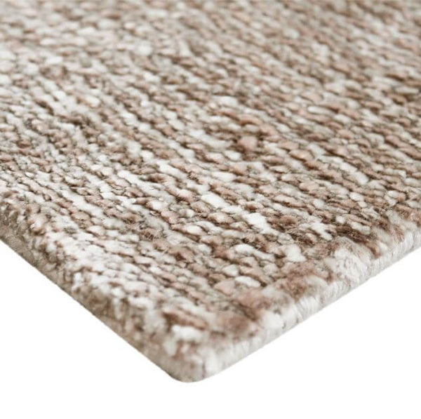 corner detail of carpet berber kela stripes beige rosa