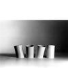 four white waste paper bins, in attesa by danese milano
