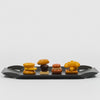 danese milano mari elisabetta | black aluminum tray with small sandwiches