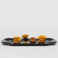 danese milano mari elisabetta | black aluminum tray with small sandwiches | ikonitaly