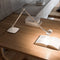 luceplan-otto-watt-slim-table-lamp-white-on-desk-book | ikonitaly