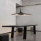 luceplan-soleil-noir-modern-hanging-lamp-black-over-table | ikonitaly