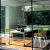 magis big will design table behind glass