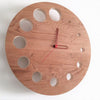 minimaproject flying saucer knotted oak wood wall clock