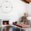 nomon delmori large two rings wall clock over fireplace