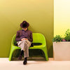 slide-amelie-duetto-green-stackable-outdoor-sofa-with-man | ikonitaly