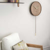 nomon swing g wall clock in wood | ikonitaly