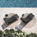 two-black-atmosphera-wind-outdoor-sunbeds-next-to-pool | ikonitaly