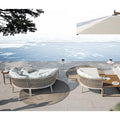 two-sand-coloured-michlenagelo-round-outdoor-rugs-in-garden | ikonitaly