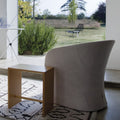 zanotta sgabillo stool natural birch next to white armchair | shop online ikonitaly